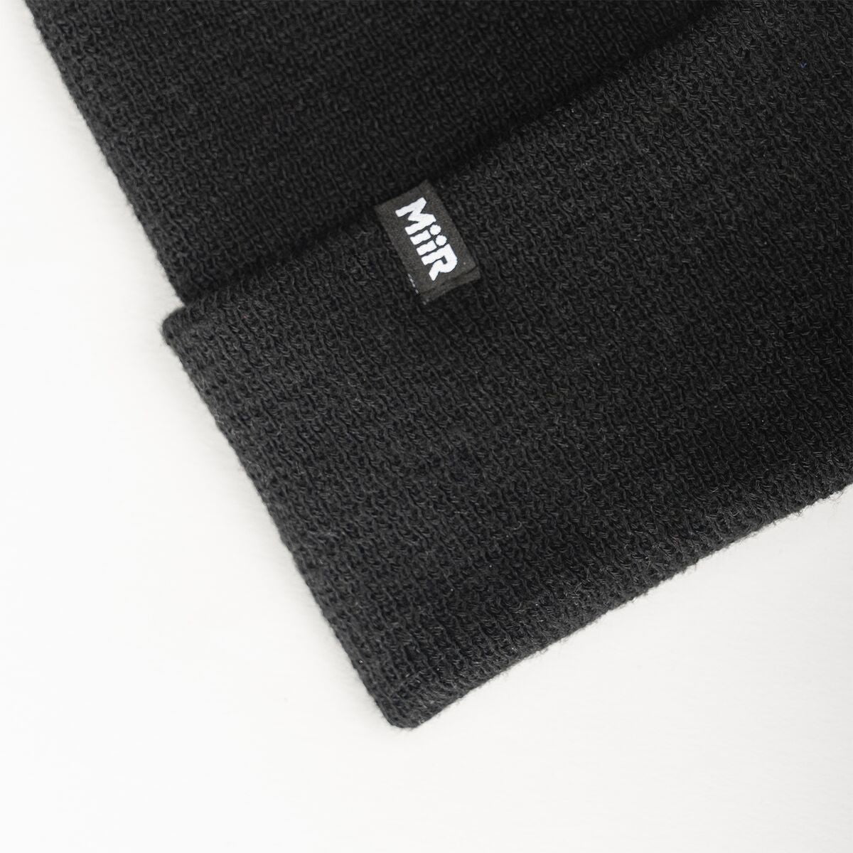 recycled-poly-fine-knit-beanie-j6 WebPDP-RecycledPolyFineKnitBeanie_Studio_TagDetail_Black__BNE005002OS.jpg