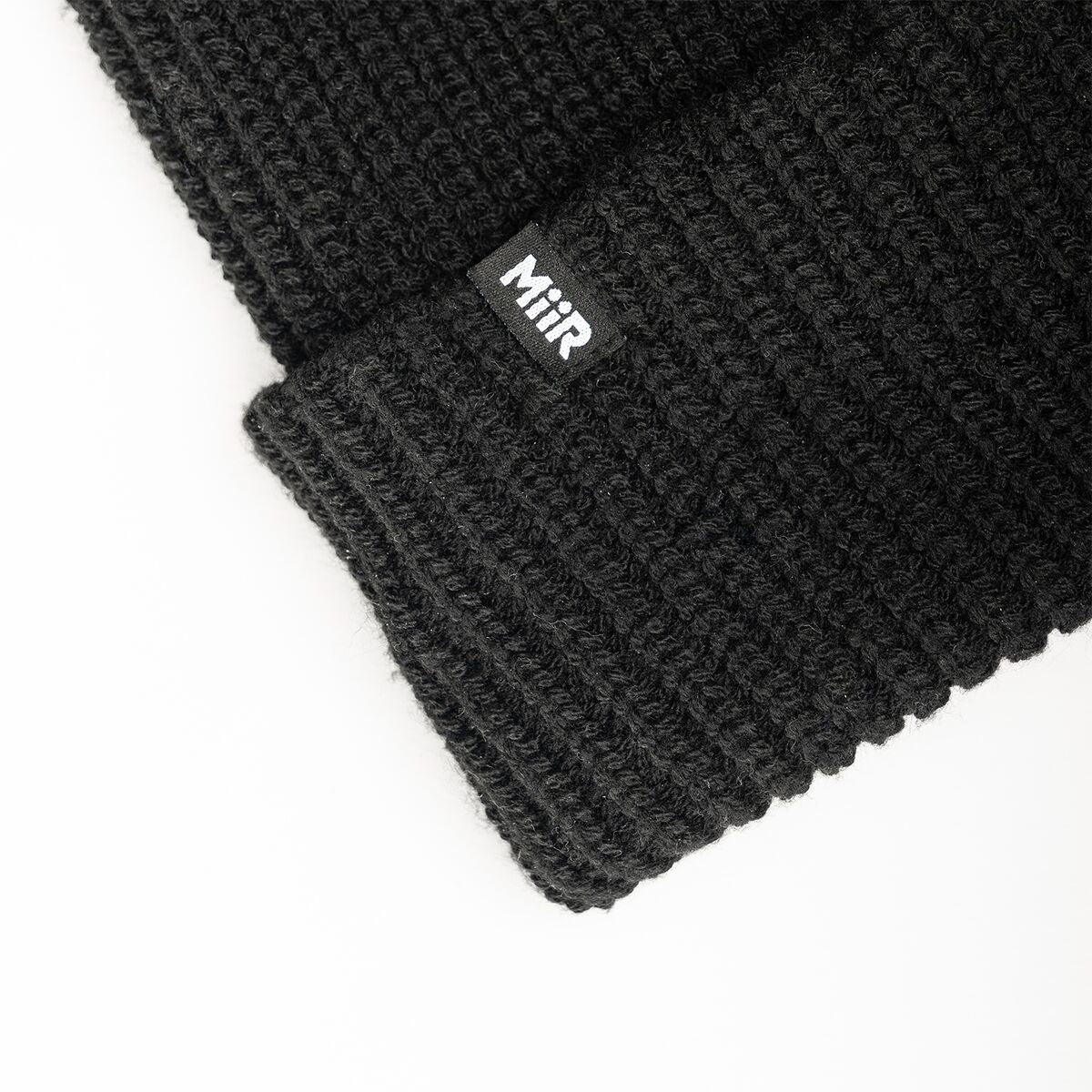 recycled-poly-rib-beanie-o7 WebPDP-RecycledPolyRibBeanie_Studio_TagDetail_Black__BNE002002OS.jpg